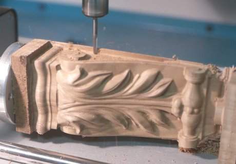 The wooden corbel being machined.