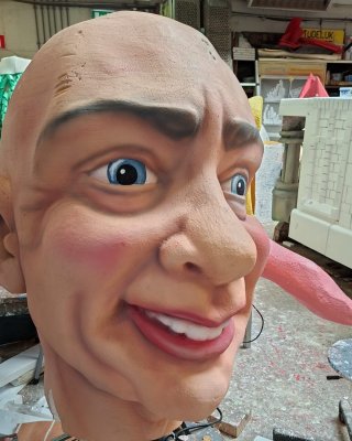 One large head, after coating and painting.
