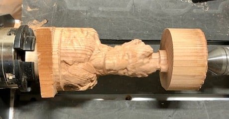 CNC machine statue in wood, still on the machine.