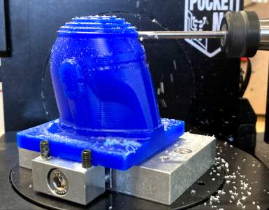 The PocketNC finishing a model of the Mandalorian helmet.